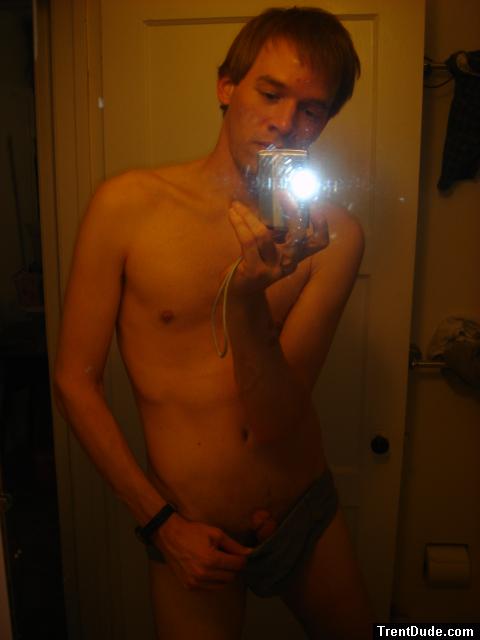 Flashing his penis in the mirror