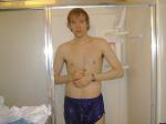 Why is he showering in his shorts?