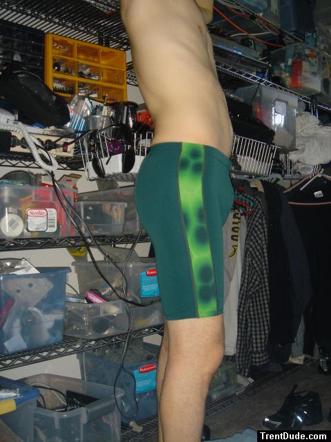 Green Nike swim trunks - closeup