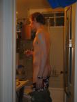 In the bathroom about to shower in the morning while dark out