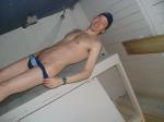Squeezing out of a swim brief to clean (legs)