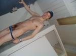 Squeezing out of a swim brief to clean (legs)