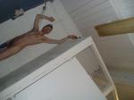Hanging a swim brief in a convenient place during the shower