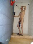 Hanging the wet swim brief on his penis to keep it clean