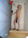 Swim brief hanging from the glans head on his penis