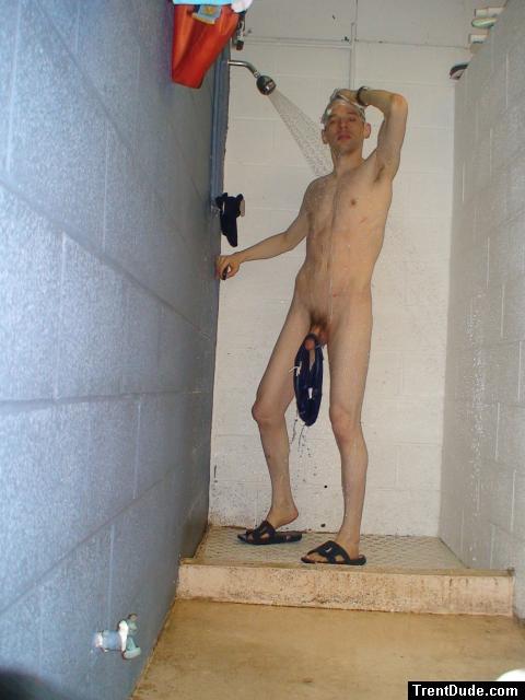 Swim brief hanging from the glans head on his penis