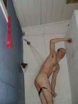 Removing black/white swim brief in the shower