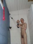 Rinsing  black/white swim brief in the shower