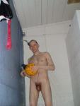 Nude water polo player in shower (rear)