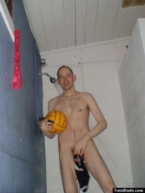 Nude water polo player in shower, hanging his swim brief