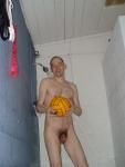 Nude water polo player in shower (penis)
