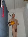 Nude in shower with a water polo ball