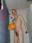 Nude in shower with a water polo ball  (flaccid penis, scrotum)