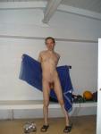 Drying off after shower, water polo ball on the bench