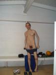 Dressing after shower, water polo ball on the bench