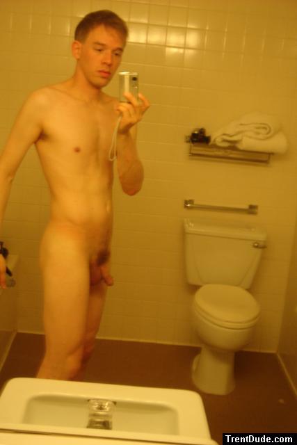 Nude in a hotel bathroom mirror, before shower