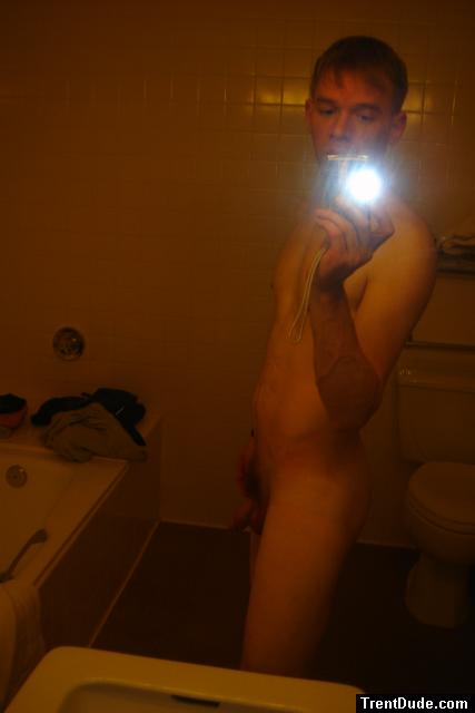 Nude in a hotel bathroom mirror, before shower
