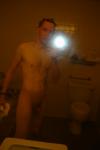 Nude in a hotel bathroom mirror, after shower
