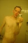Nude in a hotel bathroom mirror, after shower