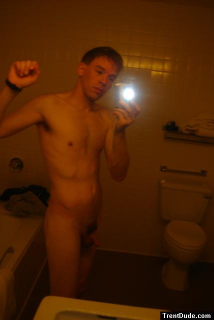 Nude in a hotel bathroom mirror, before shower