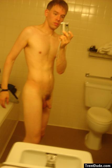 Nude in a hotel bathroom mirror, before shower