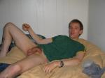 scrotal sac between his legs