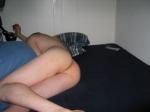 Naked in bed - rear end