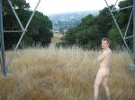 Naked outdoors  - electrical tower in the mountains!