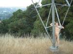 Naked outdoors  - climbing electrical tower in the mountains