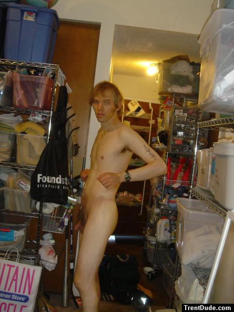 Standing nude with number tatoos, left arm