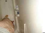 Undressing in the shower.