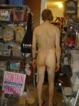 Standing nude with number tatooes on right ankle