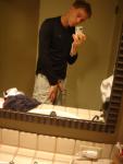 showing his penis in the mirror