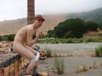 Sitting butt naked on a brick pile
