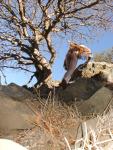 Rock climbing in the nude