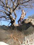 Nude rock climber