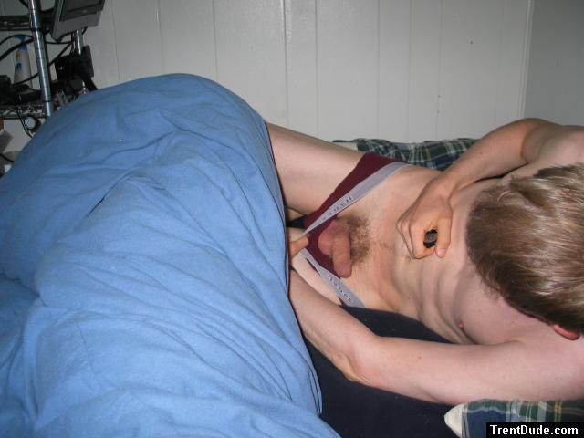 Inspecting penis in bed