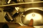 Soft penis ready for a bath in the wash tub