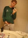 itching himself in a mirror
