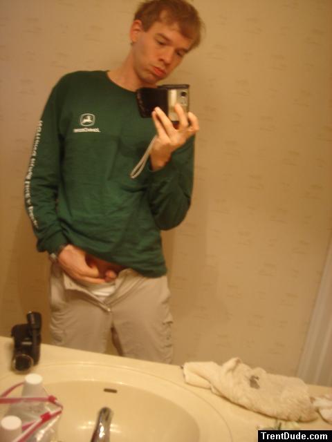 itching himself in a mirror