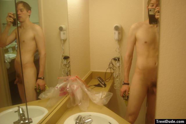 Nude in two mirror bathroom