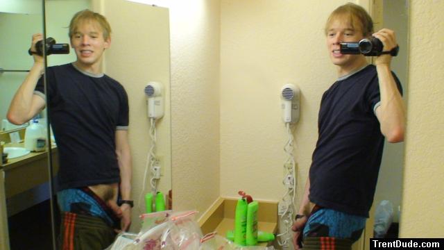 Pulling out flaccid penis in a hotel mirror (weaing Addidas Sweat Pants, Sponge bob boxers)