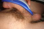 Long Penis filling an entire athletic cup, balls hanging below