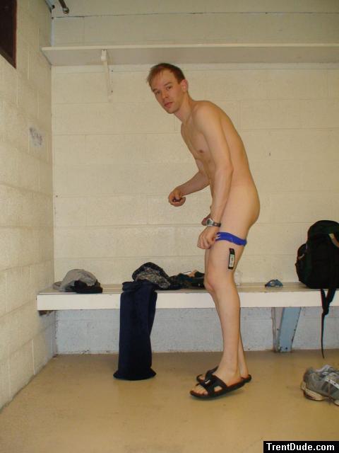 Changing into a blue speedo in the locker room