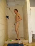 Showering in a white speedo in the swim locker room