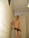undressing from a  Blue/Red stripes swim brief