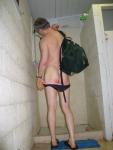 Why is he pulling his swimsuit down?