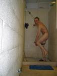 Pulling off his swim suit - hope the team doesn't come in