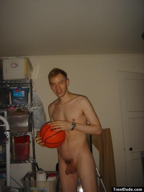 Nude while holding a basketball