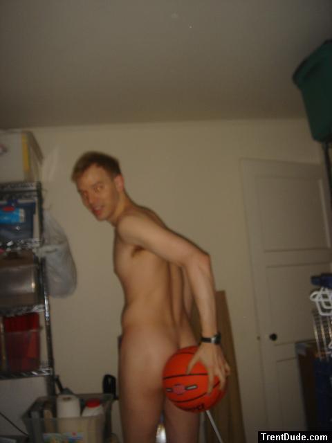 Nude while holding a basketball